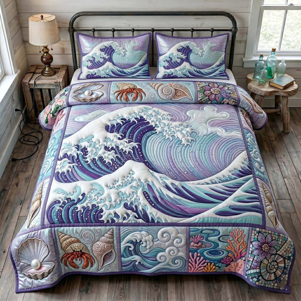 Ocean Tide quilted 3-piece bedding set on a made bed in a light coastal bedroom