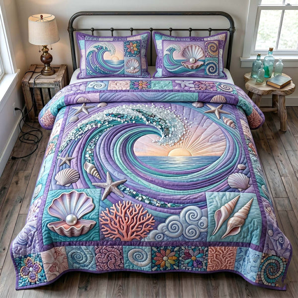Ocean Tide quilted 3-piece bedding set on a made bed in a light coastal bedroom