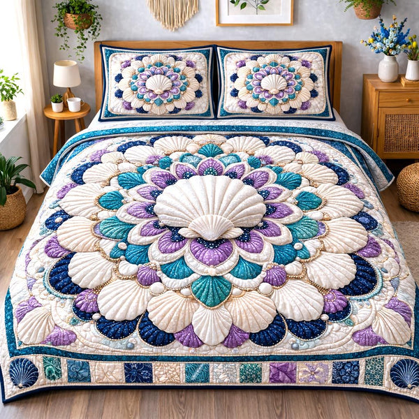 Ocean Treasure quilted 3-piece bedding set on a made bed in a light coastal bedroom