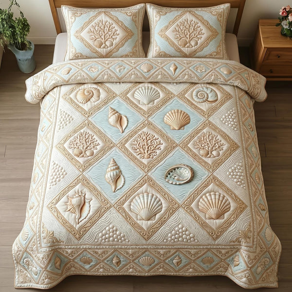 Ocean Treasure quilted 3-piece bedding set on a made bed in a light coastal bedroom