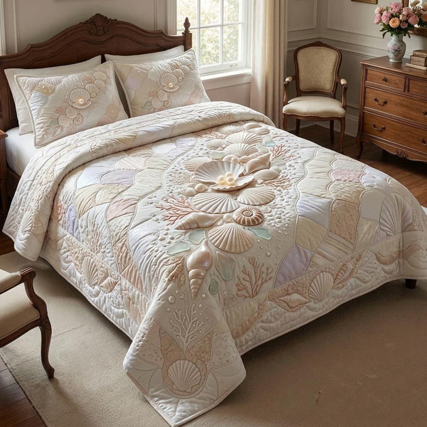 Ocean Treasures quilted 3-piece bedding set on a made bed in a light coastal bedroom