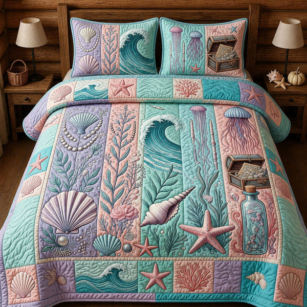 Ocean Treasures quilted 3-piece bedding set on a made bed in a light coastal bedroom