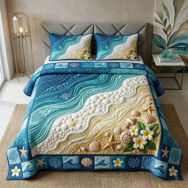 Ocean Tropic quilted 3-piece bedding set on a made bed in a light coastal bedroom