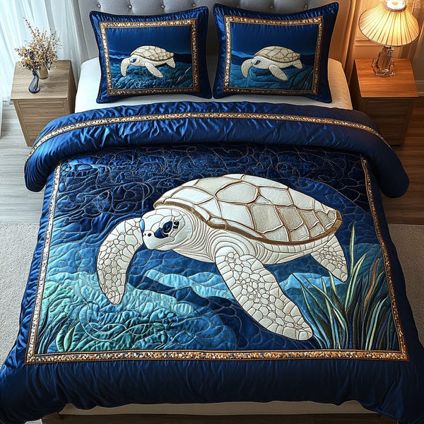 Ocean Voyager quilted 3-piece bedding set on a made bed in a light coastal bedroom