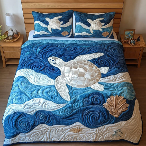 Ocean Wanderer quilted 3-piece bedding set on a made bed in a light coastal bedroom