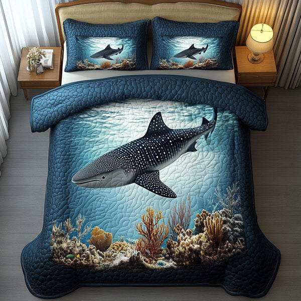 Ocean Wanderer quilted 3-piece bedding set on a made bed in a light coastal bedroom
