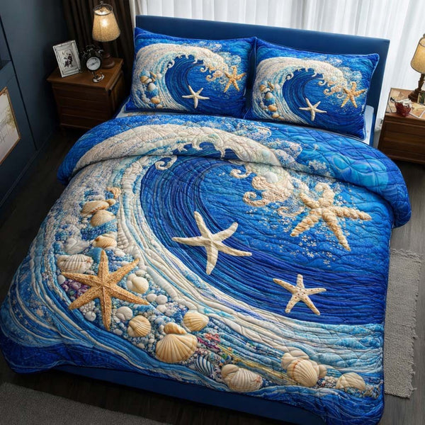 Ocean Wave quilted 3-piece bedding set on a made bed in a light coastal bedroom