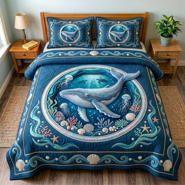 Ocean Whale Portal quilted 3-piece bedding set on a made bed in a light coastal bedroom