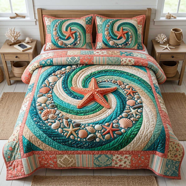 Ocean Whirl quilted 3-piece bedding set on a made bed in a light coastal bedroom