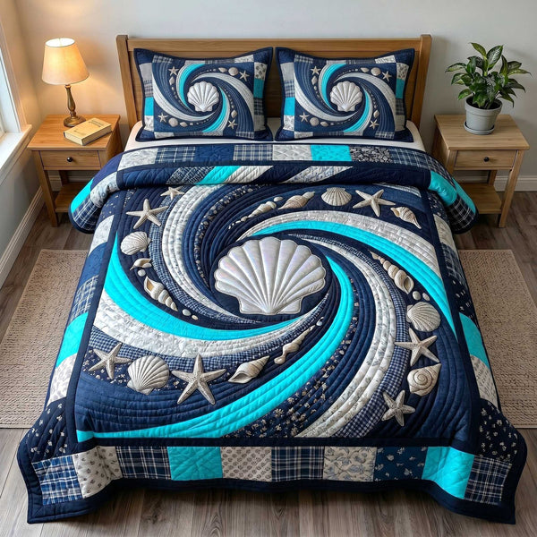 Ocean Whirl quilted 3-piece bedding set on a made bed in a light coastal bedroom