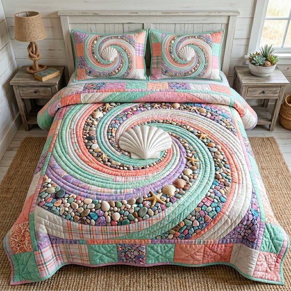 Ocean Whirl quilted 3-piece bedding set on a made bed in a light coastal bedroom