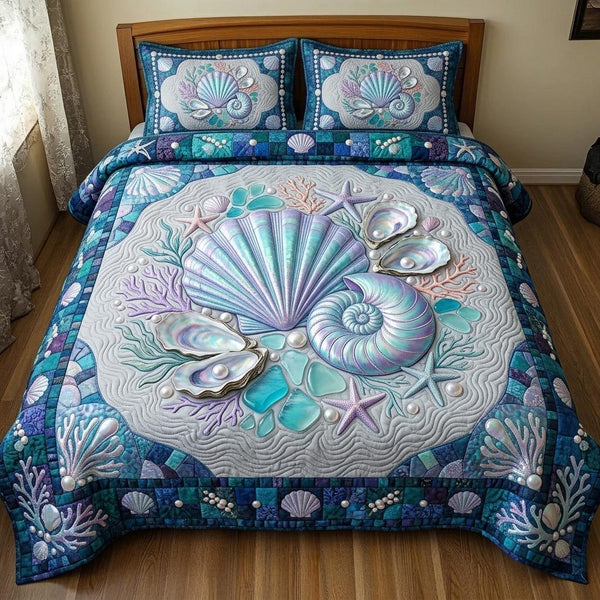 Ocean Whisper quilted 3-piece bedding set on a made bed in a light coastal bedroom