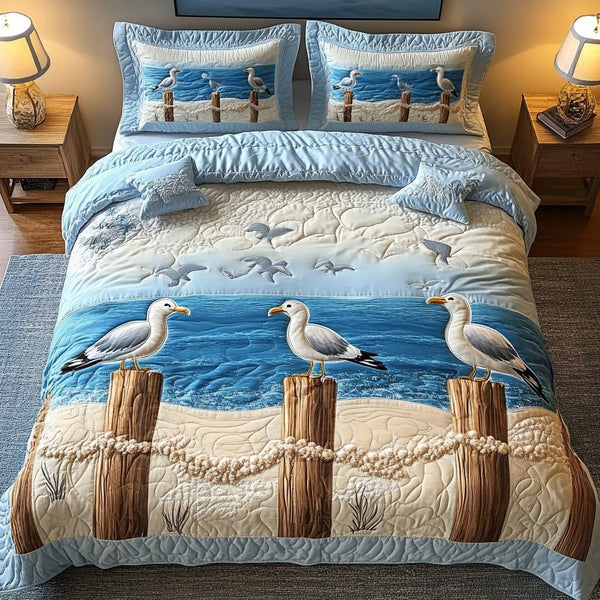 Ocean Wings quilted 3-piece bedding set on a made bed in a light coastal bedroom