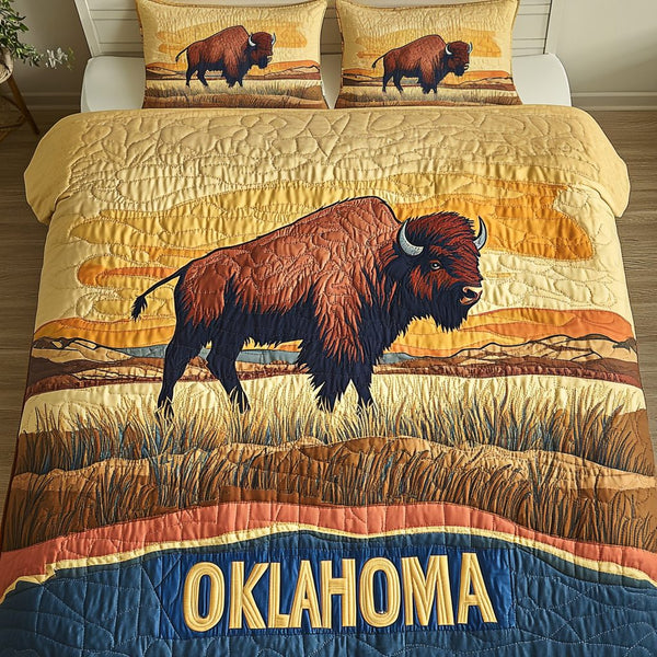 Oklahoma Spirit quilted 3-piece bedding set on a made bed with two matching pillow shams