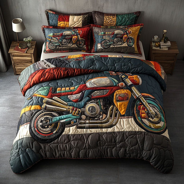 On the Open Road quilted 3-piece bedding set on a made bed with two matching pillow shams