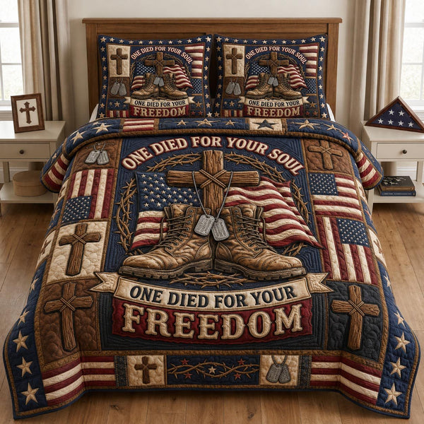 One Died For Your Freedom quilted 3-piece bedding set on a made bed in a warmly lit bedroom