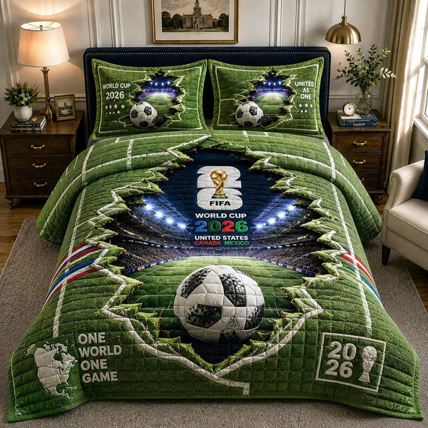 One World One Game Stadium quilted 3-piece bedding set on a made bed with two matching pillow shams