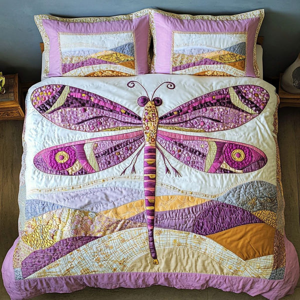 Opulent Wings quilted 3-piece bedding set on a made bed with two matching pillow shams