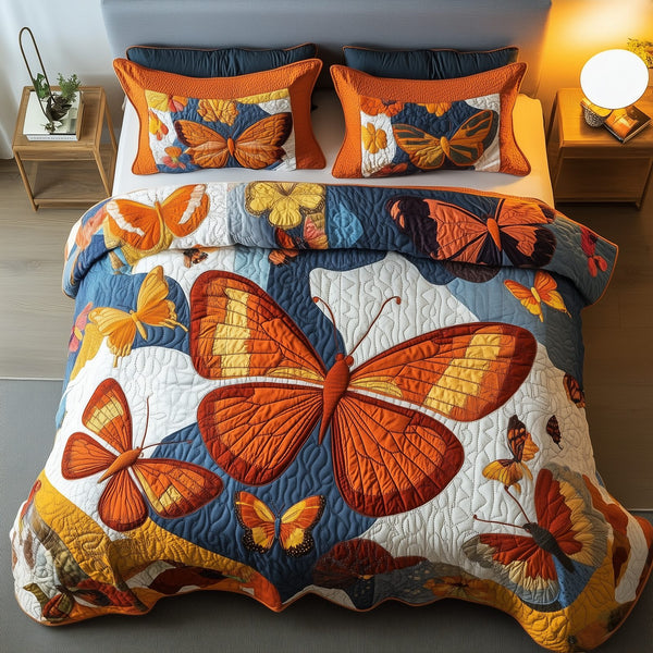 Orange Butterflies quilted 3-piece bedding set on a made bed with two matching pillow shams