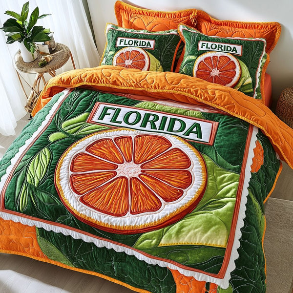 Orange Grove quilted 3-piece bedding set on a made bed with two matching pillow shams