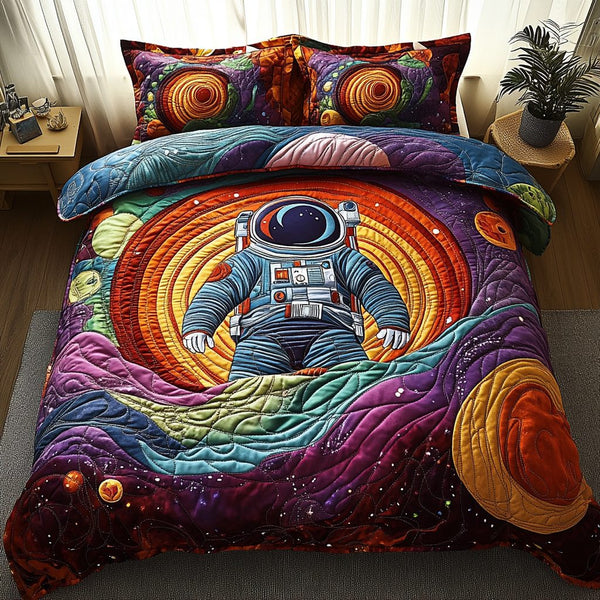 Orbit Adventures quilted 3-piece bedding set on a made bed in a winter-styled bedroom