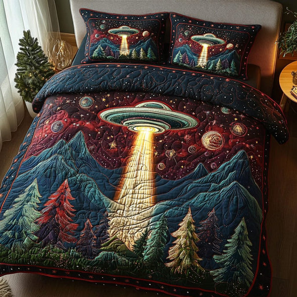 Orbit Odyssey quilted 3-piece bedding set on a made bed with two matching pillow shams