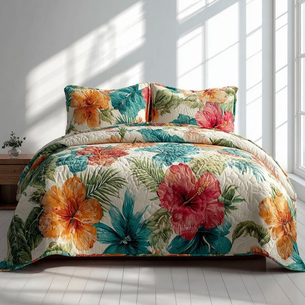Orchid Oasis quilted 3-piece bedding set on a made bed with two matching pillow shams