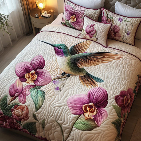 Orchid Serenade quilted 3-piece bedding set on a made bed with two matching pillow shams