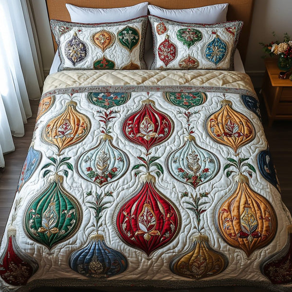 Ornate Harmony quilted 3-piece bedding set on a made bed with two matching pillow shams