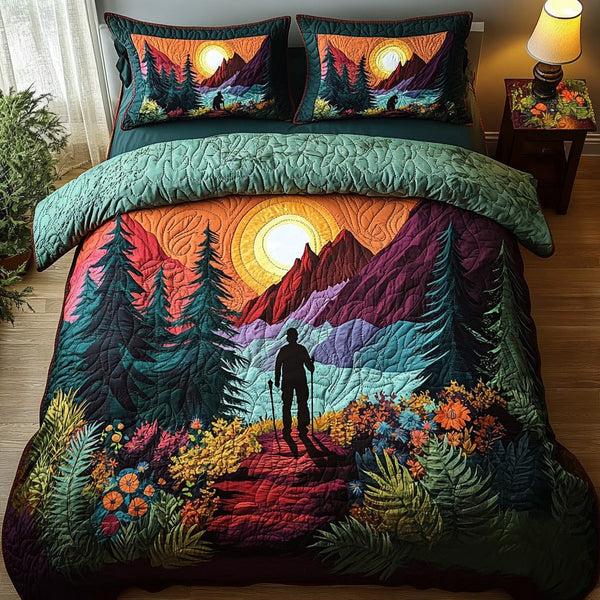 Outdoor Odyssey quilted 3-piece bedding set on a made bed with two matching pillow shams