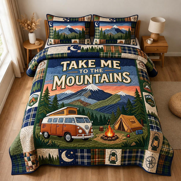 Outdoor Retreat quilted 3-piece bedding set on a made bed with two matching pillow shams