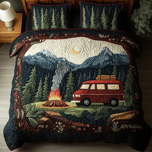Outdoor Spirit quilted 3-piece bedding set on a made bed with two matching pillow shams