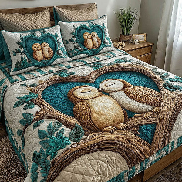 Owl Couple quilted 3-piece bedding set on a made bed with two matching pillow shams