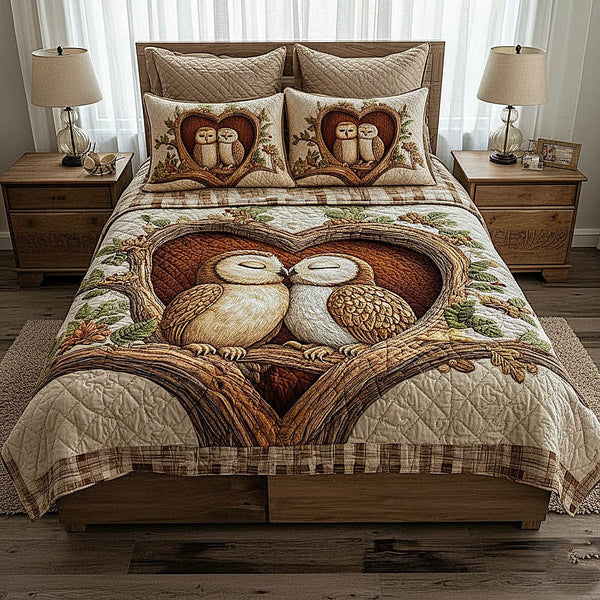Owl Couple quilted 3-piece bedding set on a made bed with two matching pillow shams