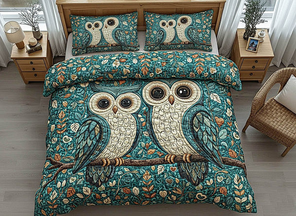 Owl Couple quilted 3-piece bedding set on a made bed with two matching pillow shams