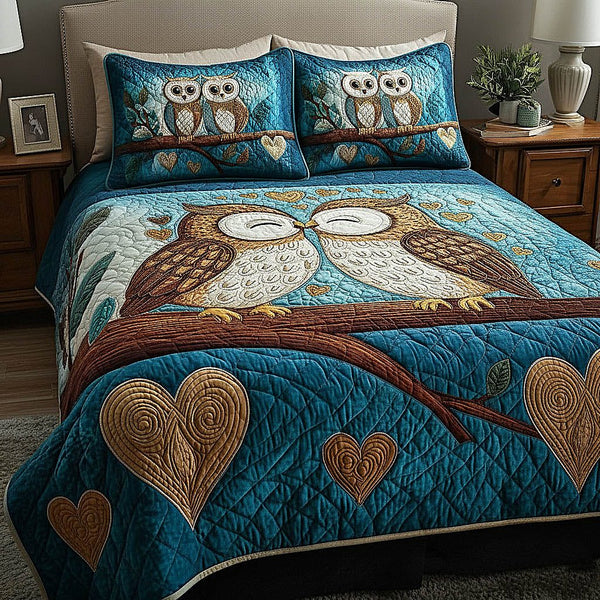 Owl Couple quilted 3-piece bedding set on a made bed with two matching pillow shams