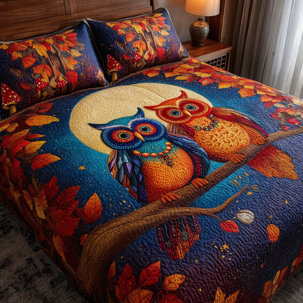 Owl Flight quilted 3-piece bedding set on a made bed with two matching pillow shams