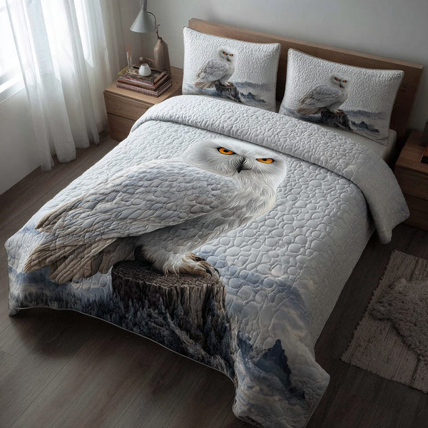 Owl Flight quilted 3-piece bedding set on a made bed with two matching pillow shams