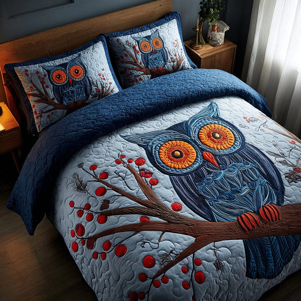 Owl Night quilted 3-piece bedding set on a made bed with two matching pillow shams
