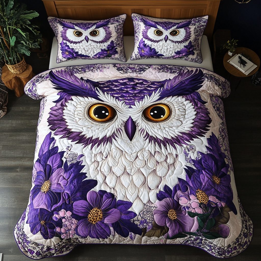 Owl Wisdom quilted 3-piece bedding set on a made bed with two matching pillow shams
