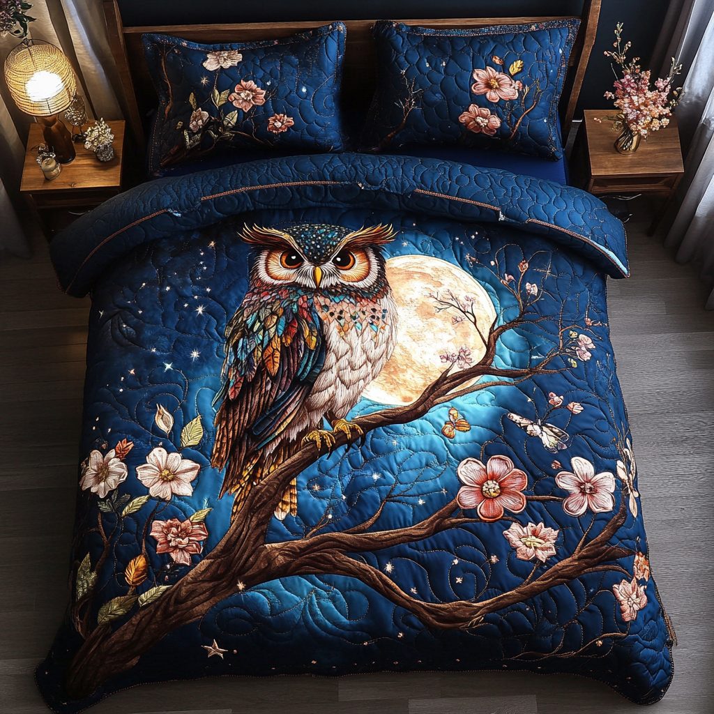 Owl Wisdom quilted 3-piece bedding set on a made bed with two matching pillow shams