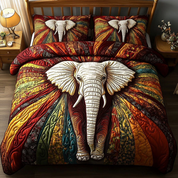 Pachyderm Paradise quilted 3-piece bedding set on a made bed with two matching pillow shams