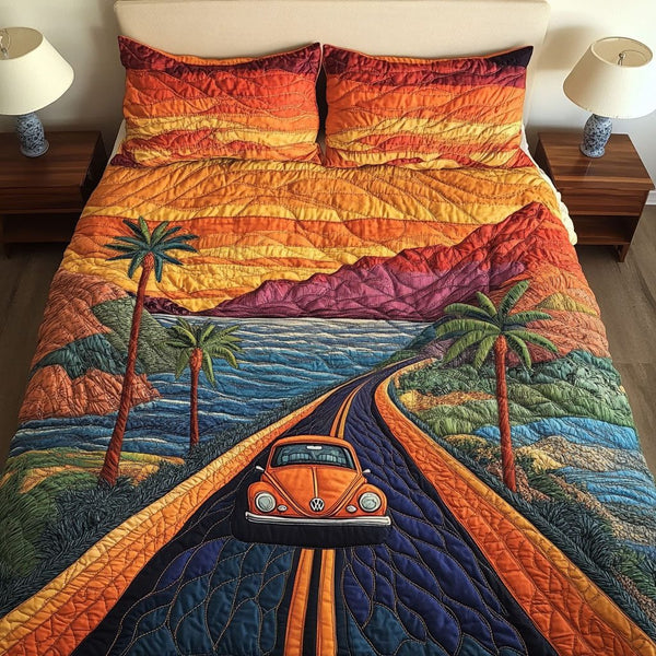 Pacific Escape quilted 3-piece bedding set on a made bed with two matching pillow shams