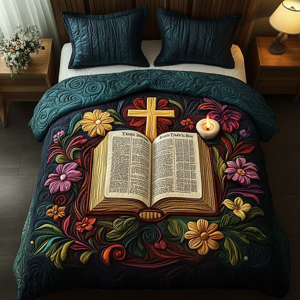 Pages of Grace quilted 3-piece bedding set on a made bed with two matching pillow shams