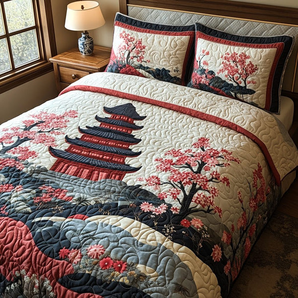 Pagoda Bloom quilted 3-piece bedding set on a made bed with two matching pillow shams