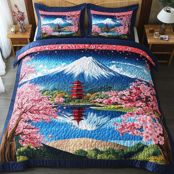 Pagoda Bloom quilted 3-piece bedding set on a made bed with two matching pillow shams
