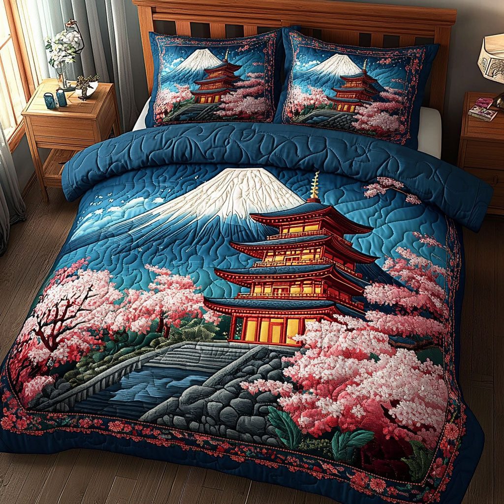 Pagoda Blossoms quilted 3-piece bedding set on a made bed with two matching pillow shams