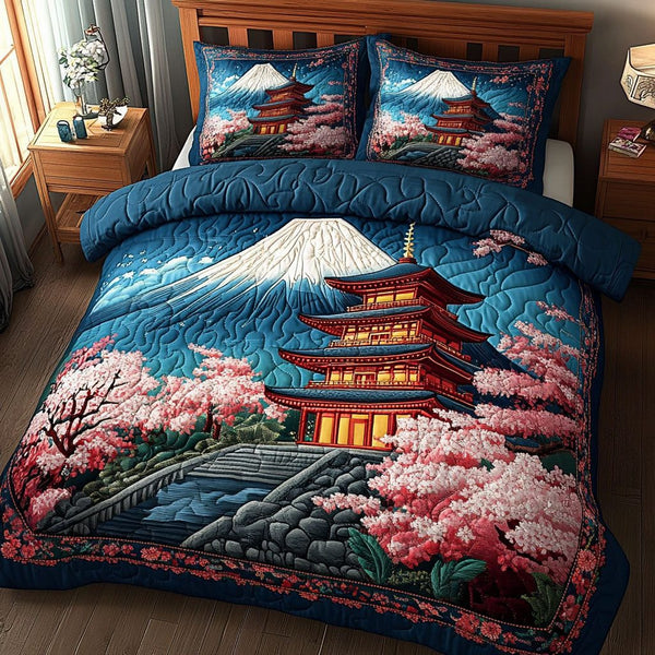 Pagoda Blossoms quilted 3-piece bedding set on a made bed with two matching pillow shams