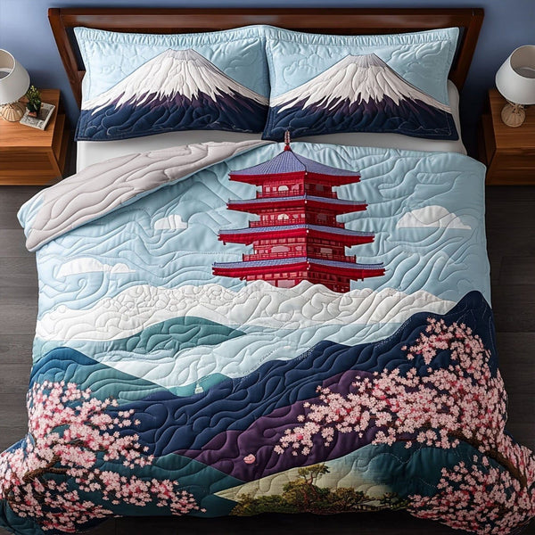 Pagoda Dreams quilted 3-piece bedding set on a made bed with two matching pillow shams