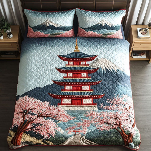 Pagoda Pathway quilted 3-piece bedding set on a made bed with two matching pillow shams